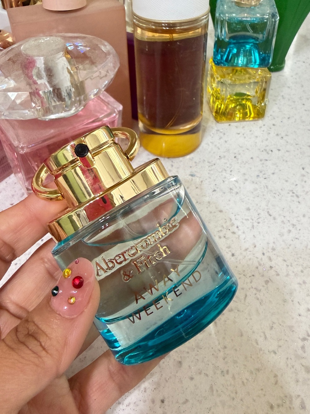Fragrance bottle held in hand